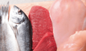 fish laying next to raw red meat an chicken